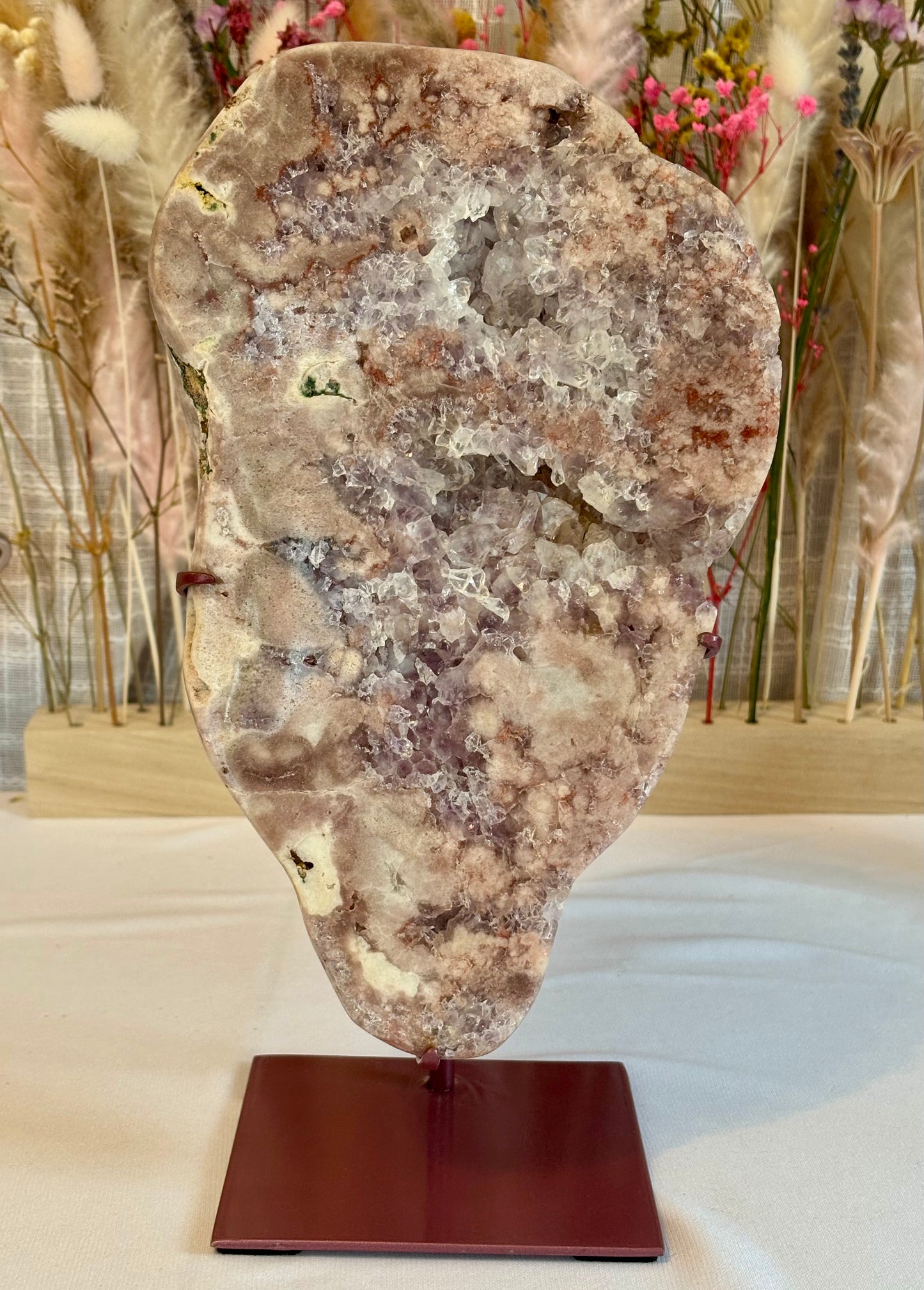 Elegant pink amethyst slab on custom stand