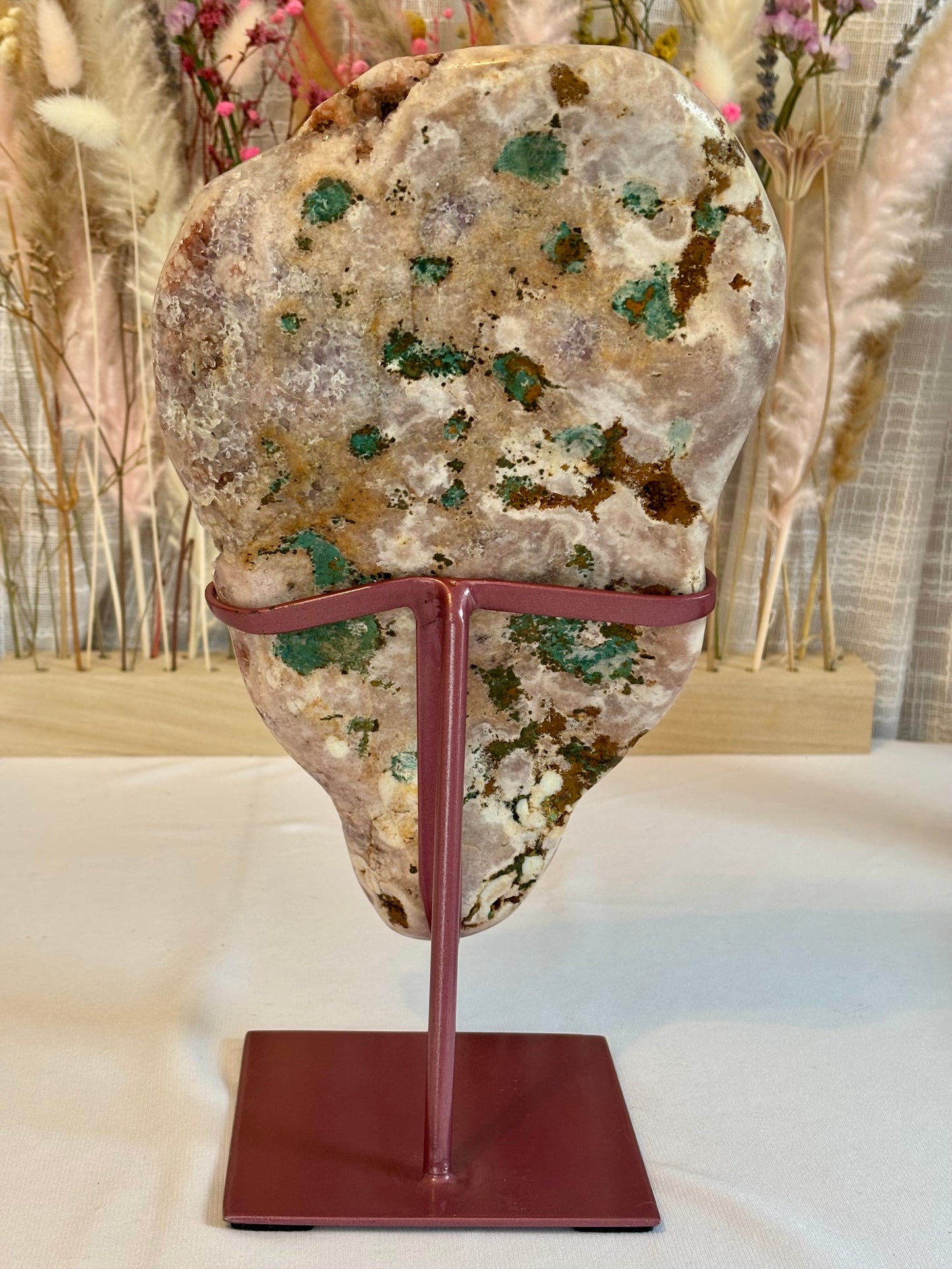 Elegant pink amethyst slab on custom stand