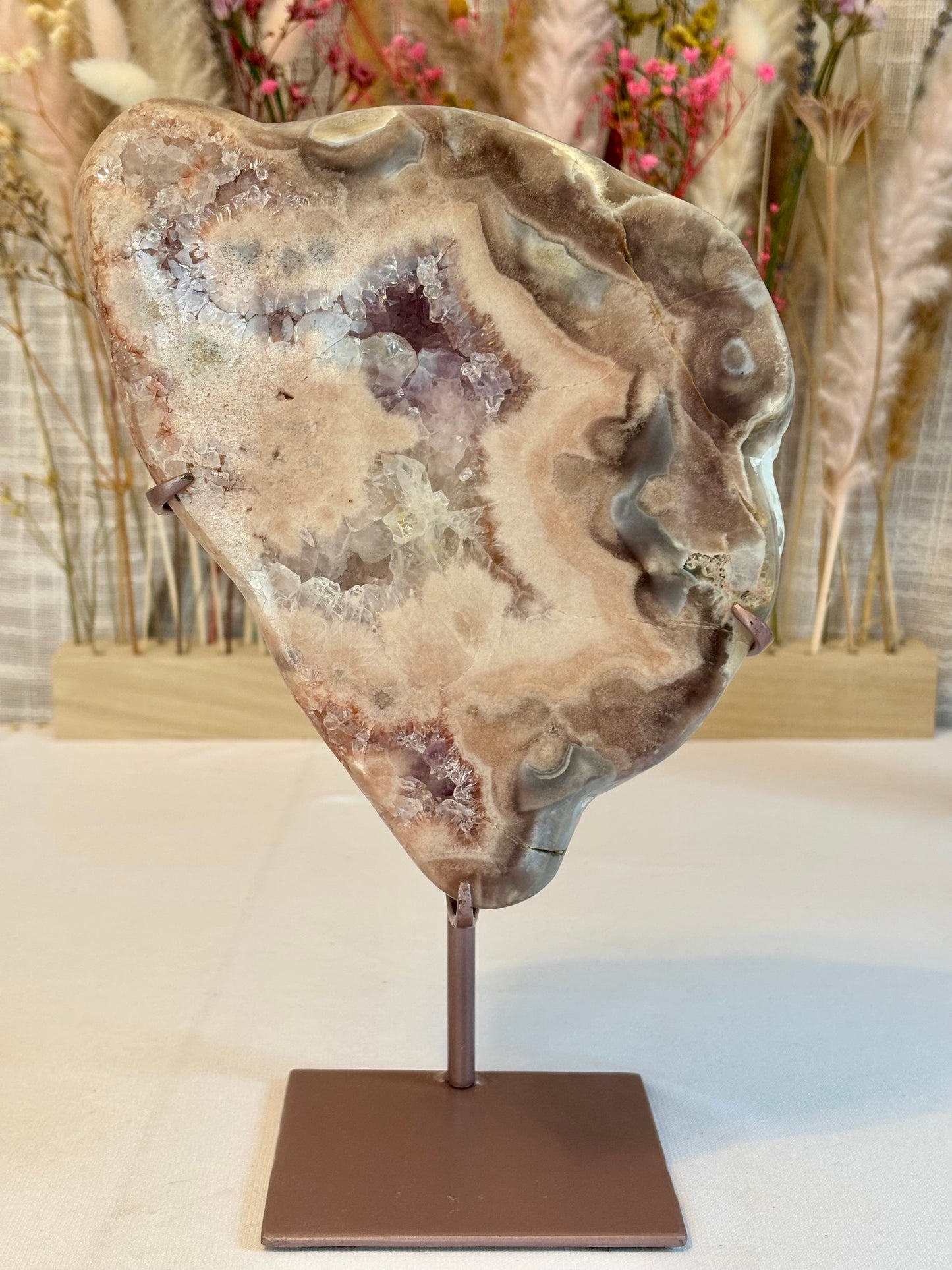 Pink amethyst slab featuring swirly, multi-colored patterns